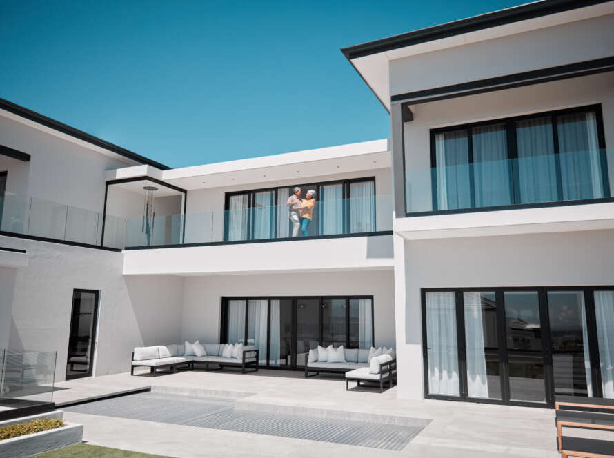 Senior couple in luxury home, house or real estate property while happy, bond and satisfied with we